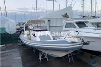 2020 Capelli Tempest 40 boat docked at marina, surrounded by other vessels.