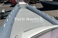 2020 Capelli Tempest 40 boat with gray inflatable tubes and deck, docked at marina.