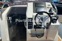 Cockpit of 2020 Capelli Tempest 40 boat with steering wheel and control panel.