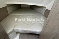 Interior cabin of 2020 Capelli Tempest 40 boat with cushioned sleeping area.