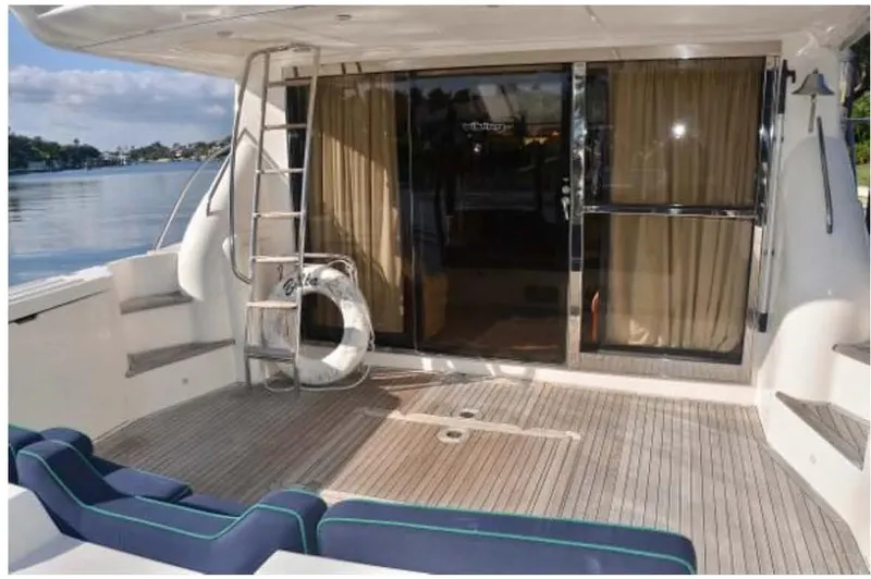  Yacht Photos Pics 2000 Viking Princess Sport Cruiser yacht deck with seating and ladder.