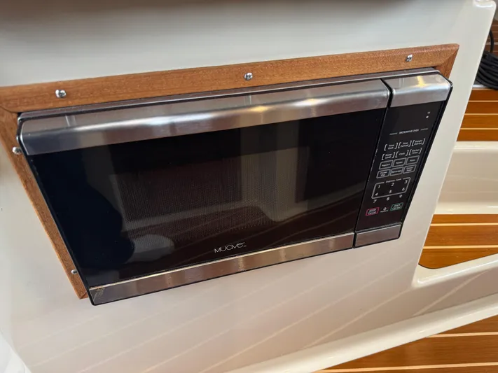  Yacht Photos Pics Built-in microwave in 2021 Ranger Tugs R-31 CB boat interior.