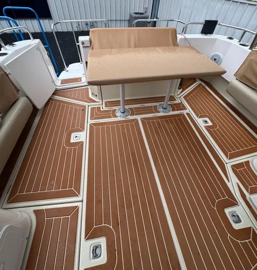  Yacht Photos Pics 2021 Ranger Tugs R-31 CB boat deck with wood finish and seating area.