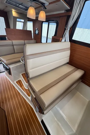  Yacht Photos Pics Interior of 2021 Ranger Tugs R-31 CB with elegant seating and wood accents.