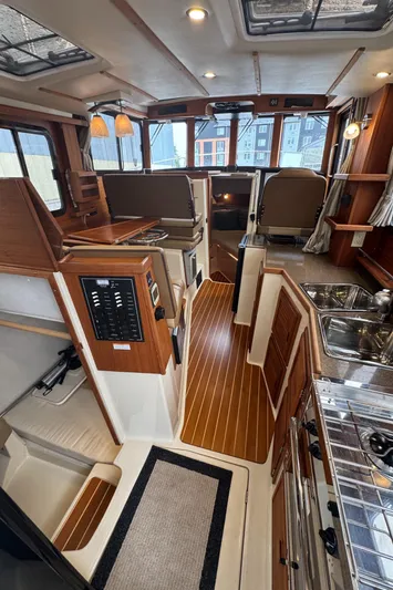  Yacht Photos Pics Interior of 2021 Ranger Tugs R-31 CB with wood finishes and modern amenities.
