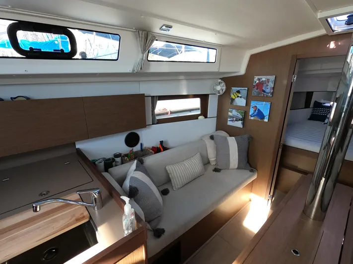  Yacht Photos Pics Interior of 2021 Beneteau Oceanis 38.1 yacht, featuring cozy seating and modern design.