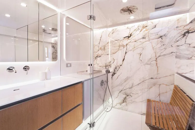 Betame Yacht Photos Pics Luxurious bathroom in 2021 Sunreef 60 yacht with marble walls and modern fixtures.