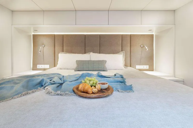 Betame Yacht Photos Pics Luxurious Sunreef 60 yacht bedroom with cozy bedding and breakfast tray, 2021 model.