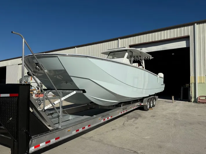  Yacht Photos Pics 2022 Barker Boatworks 40 HPC on trailer outside a warehouse.