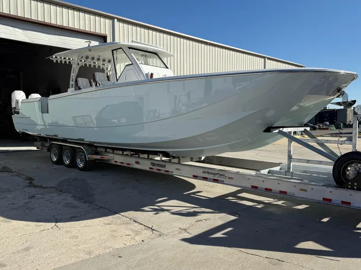  Yacht Photos Pics 2022 Barker Boatworks 40 HPC on trailer outside warehouse.