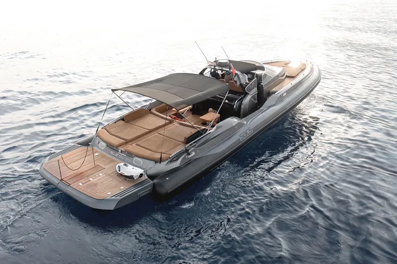 Aquaholic Yacht Photos Pics 2017 Sacs Marine Strider 18 luxury boat on calm water, featuring sleek design and spacious deck.