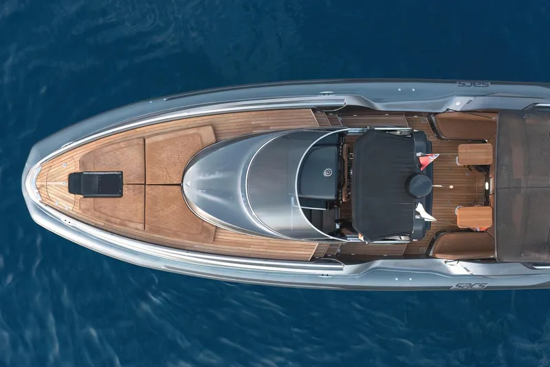 Aquaholic Yacht Photos Pics Top view of 2017 Sacs Marine Sacs Strider 18 luxury yacht on blue water.