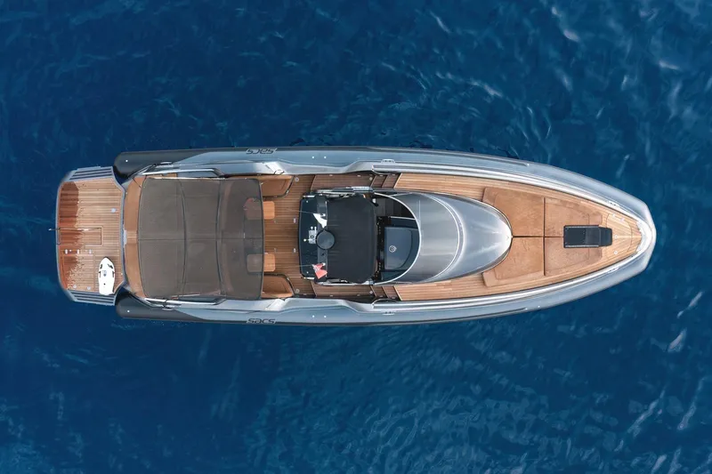 Aquaholic Yacht Photos Pics Top view of 2017 Sacs Marine Sacs Strider 18 luxury yacht on blue water.