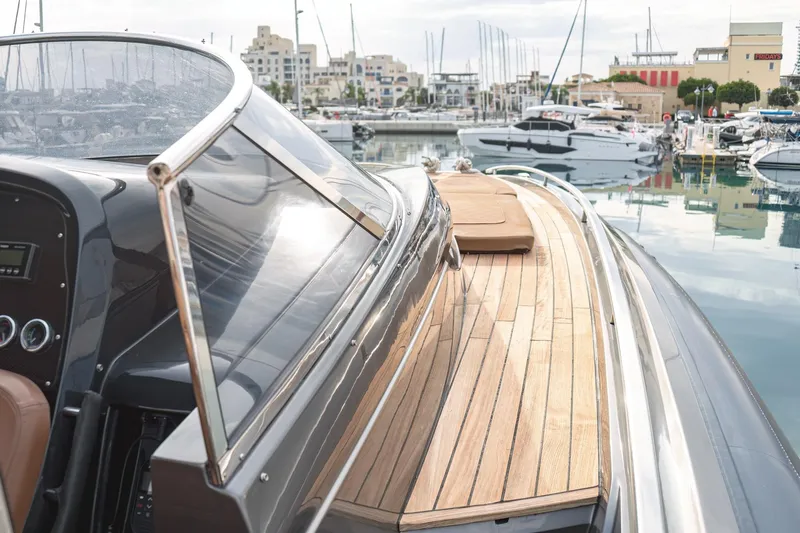 Aquaholic Yacht Photos Pics 2017 Sacs Marine Strider 18 luxury yacht docked in a marina.