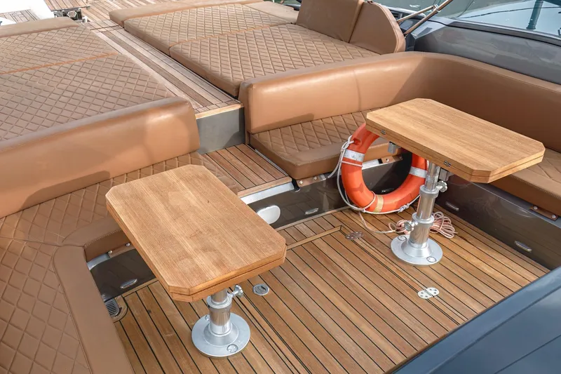 Aquaholic Yacht Photos Pics Luxurious 2017 Sacs Marine Strider 18 boat interior with teak deck and cushioned seating.