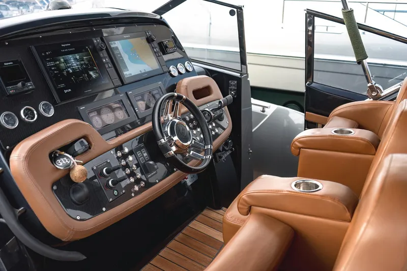 Aquaholic Yacht Photos Pics Luxurious 2017 Sacs Marine Strider 18 yacht cockpit with leather seating and advanced navigation controls.