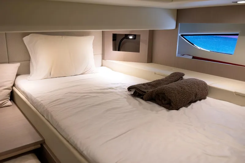 Aquaholic Yacht Photos Pics Luxurious cabin interior of 2017 Sacs Marine Sacs Strider 18 yacht with cozy bedding.
