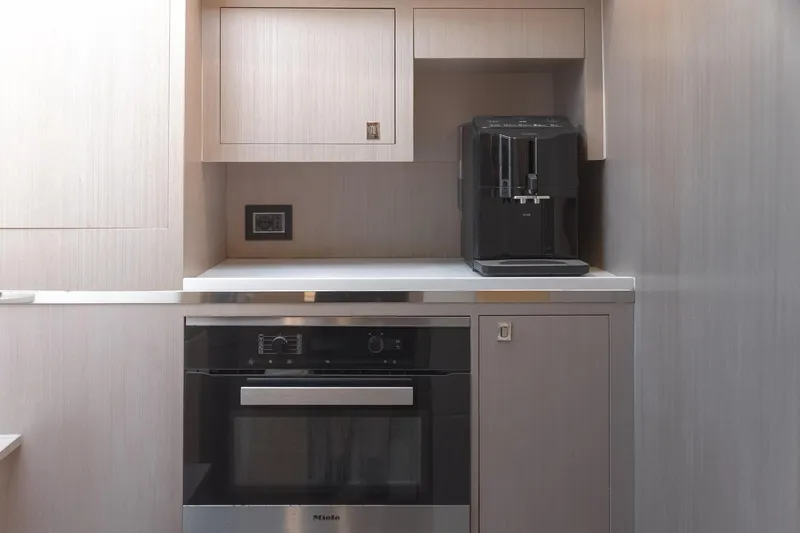 Aquaholic Yacht Photos Pics Modern kitchen area on 2017 Sacs Marine Sacs Strider 18 yacht with coffee machine and oven.