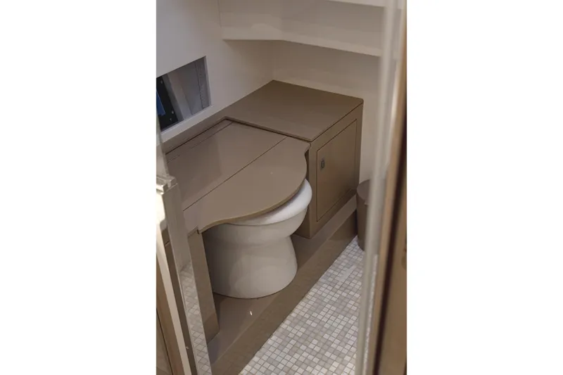 Aquaholic Yacht Photos Pics 2017 Sacs Marine Strider 18 boat bathroom interior with compact design and modern fixtures.