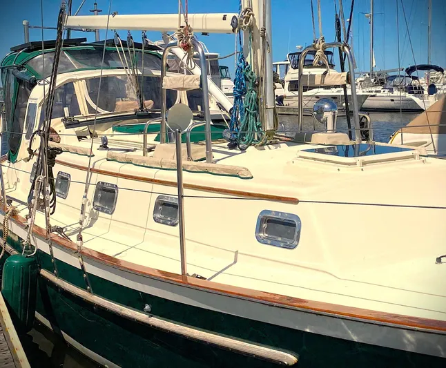 Aria Yacht Photos Pics Pacific Seacraft 37 sailboat, 2000 model, docked at marina with clear blue sky.