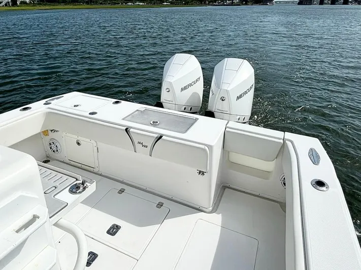  Yacht Photos Pics 2004 SeaVee 310B boat with dual Mercury engines on calm water.