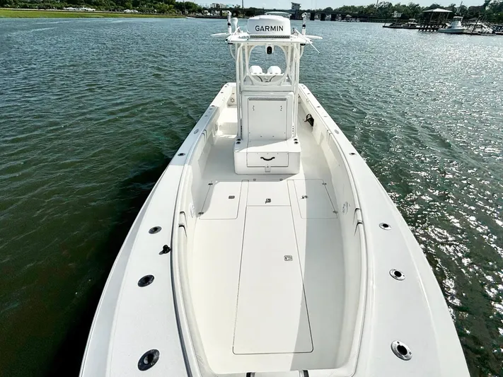  Yacht Photos Pics 2004 SeaVee 310B boat on water, featuring spacious deck and Garmin equipment.