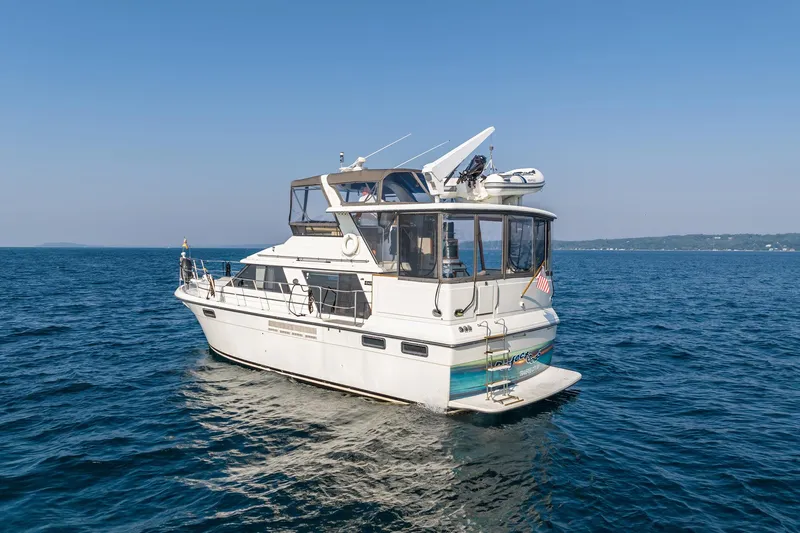Perfectseas Yacht Photos Pics 1988 Carver 42 Aft Cabin Motoryacht cruising on open water.