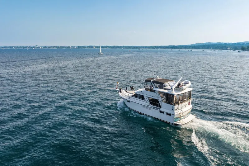 Perfectseas Yacht Photos Pics 1988 Carver 42 Aft Cabin Motoryacht cruising on open water under clear skies.