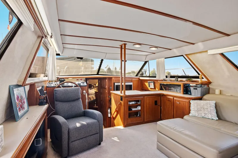 Perfectseas Yacht Photos Pics Interior of 1988 Carver 42 Aft Cabin Motoryacht with luxurious seating and wood accents.