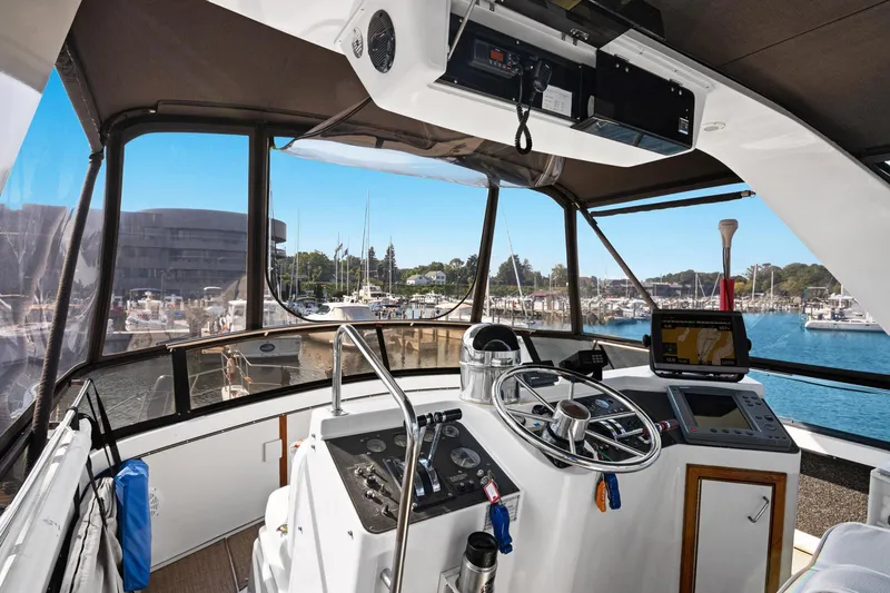 Perfectseas Yacht Photos Pics Helm of 1988 Carver 42 Aft Cabin Motoryacht overlooking marina.