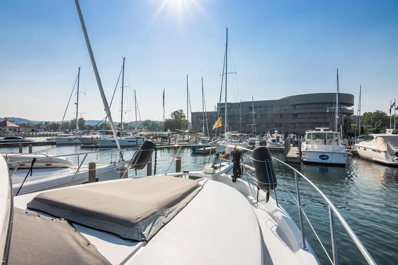 Perfectseas Yacht Photos Pics 1988 Carver 42 Aft Cabin Motoryacht docked in a sunny marina setting.