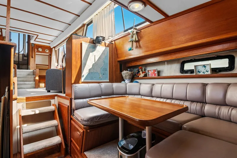 Perfectseas Yacht Photos Pics 1988 Carver 42 Aft Cabin Motoryacht interior with cozy dining area and nautical decor.