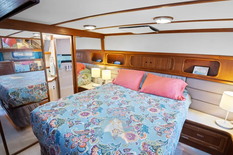Perfectseas Yacht Photos Pics 1988 Carver 42 Aft Cabin Motoryacht bedroom with floral bedding and wood accents.
