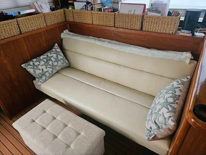  Yacht Photos Pics Cream leather sofa with starfish pillows on a 1999 Riviera 40AC boat.