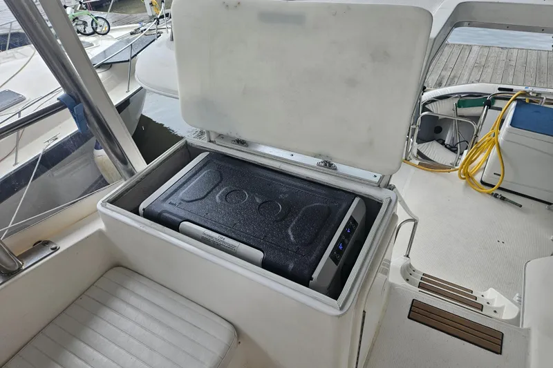  Yacht Photos Pics Open storage compartment on 1999 Riviera 40AC boat deck.