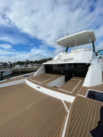  Yacht Photos Pics 2020 Leopard 43 Powercat yacht with spacious deck and modern design, docked at marina.