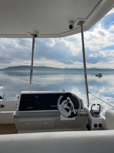  Yacht Photos Pics 2020 Leopard 43 Powercat helm with serene ocean view and cloudy sky.