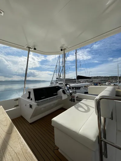  Yacht Photos Pics Leopard 43 Powercat 2020 helm station with marina view, featuring sleek design and modern controls.