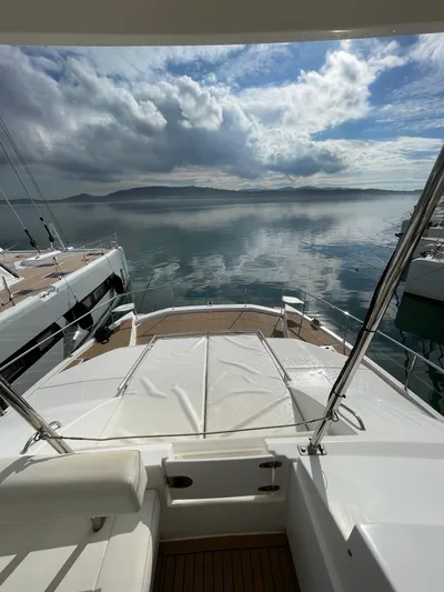  Yacht Photos Pics 2020 Leopard 43 Powercat yacht with scenic ocean view and cloudy sky.