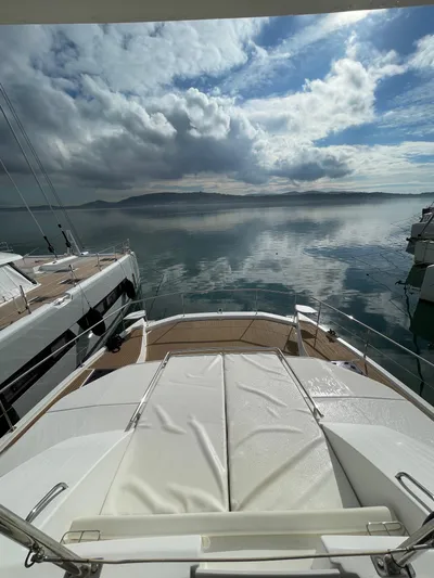  Yacht Photos Pics Leopard 43 Powercat 2020 on calm waters under a cloudy sky.