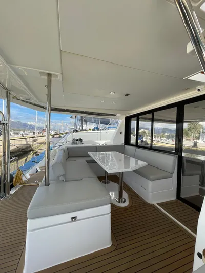  Yacht Photos Pics 2020 Leopard 43 Powercat yacht with spacious outdoor seating and dining area.