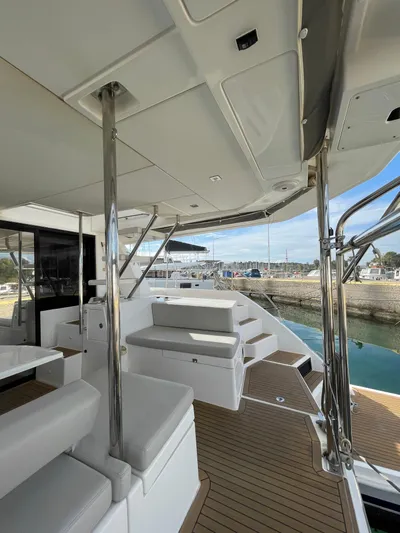  Yacht Photos Pics Leopard 43 Powercat 2020 yacht deck with seating, sleek design, and waterfront view.