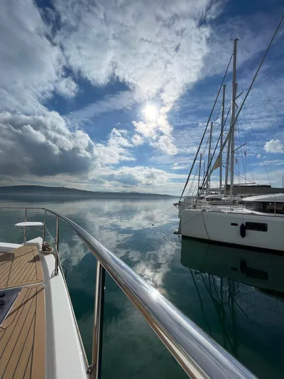  Yacht Photos Pics Leopard 43 Powercat 2020 on calm water under a partly cloudy sky.
