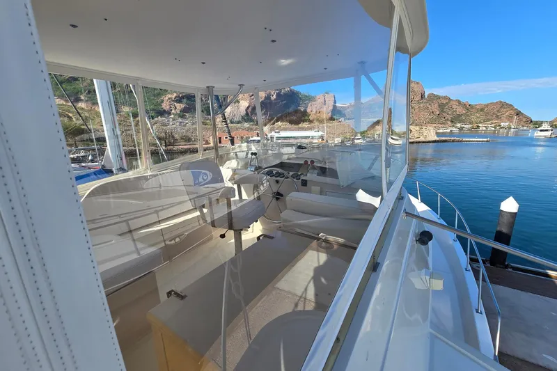 The Wetbar Yacht Photos Pics 1989 Offshore Yachts 48 Sedan interior with scenic marina view.