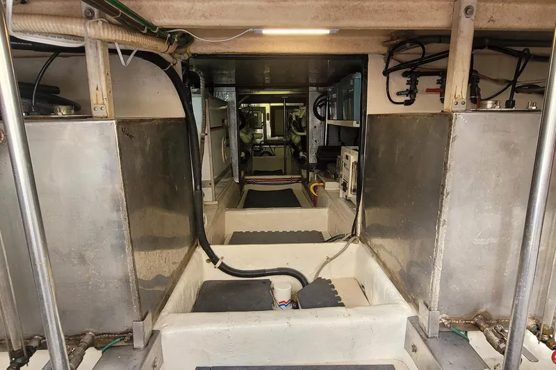 The Wetbar Yacht Photos Pics Engine room of 1989 Offshore Yachts 48 Sedan, showcasing machinery and equipment.