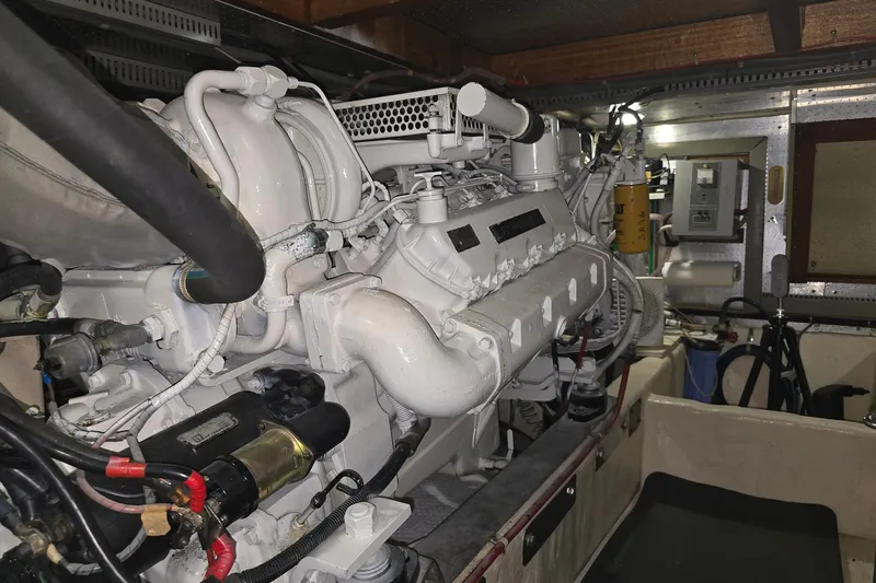 The Wetbar Yacht Photos Pics Engine room of 1989 Offshore Yachts 48 Sedan, showcasing detailed machinery.
