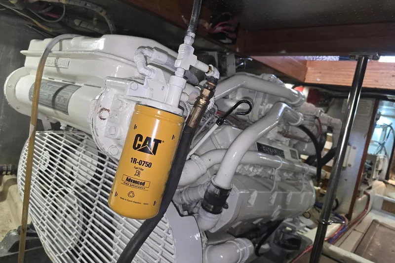 The Wetbar Yacht Photos Pics Engine room of 1989 Offshore Yachts 48 Sedan with CAT fuel filter.