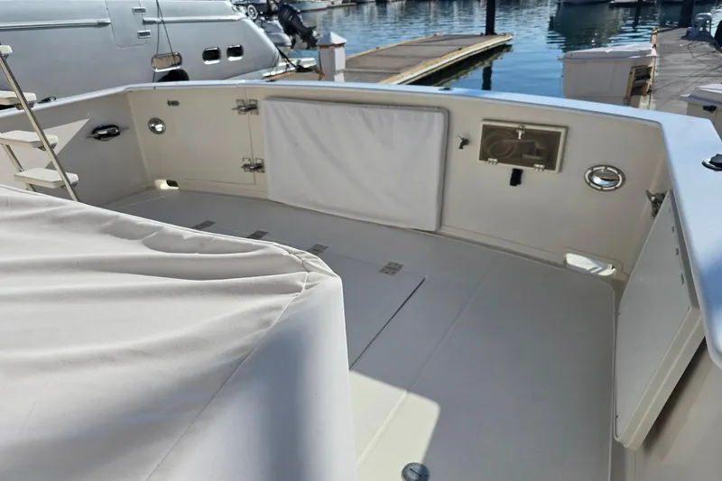 The Wetbar Yacht Photos Pics 1989 Offshore Yachts 48 Sedan deck view at marina, showcasing spacious layout.