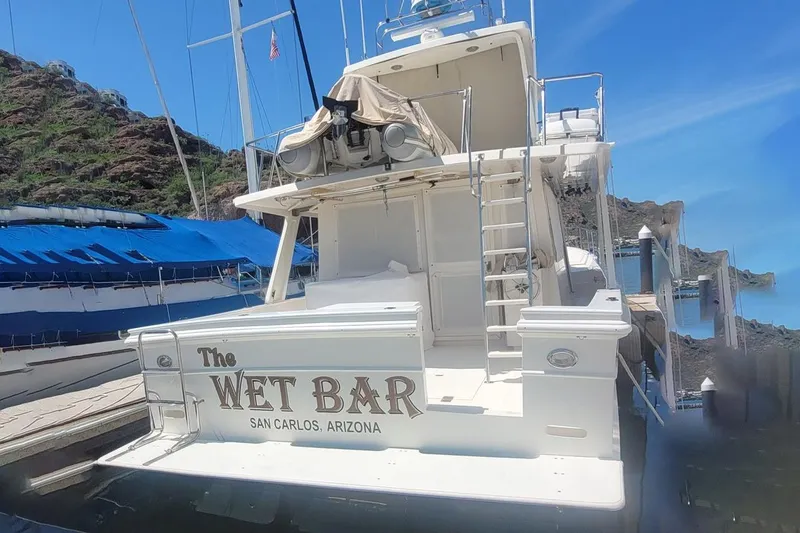 The Wetbar Yacht Photos Pics 1989 Offshore Yachts 48 Sedan docked, named "The Wet Bar," San Carlos, Arizona.