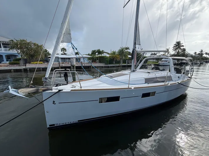Rio Babe Yacht Photos Pics 2015 Beneteau Oceanis 35 sailboat docked in a serene marina setting.